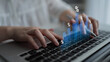 © InfiniteFlow - Close-up of hands working on a laptop keyboard with digital graphs and percentages, illustrating concepts of financial growth and data analysis in a bright workspace. Cyphers