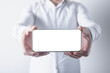 © Artvibe - Businessman holding smartphone with blank screen on white background. Mock up