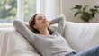 © sch.photosai - Relaxed Woman Resting Comfortably on Sofa in Soft Natural Daylight