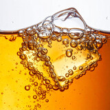 Refreshing golden beverage with ice