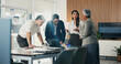 © peopleimages.com - Meeting, finance and business people in office with documents for financial review, feedback and profit. Planning, teamwork and workers with graphs, discussion and research for analysis or growth