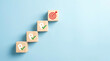 © Rahman - Wooden blocks stacked as a staircase with location pin icons and a target icon on top, business goal achievement concept