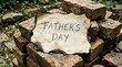 © Paliyem_Studio - Father's Day message on a brick pile outdoors