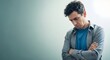 © ArtSync Studio - Disappointed Man with Arms Crossed Standing Alone Against a Muted Background