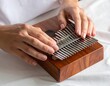 © bocah - A person plays a musical instrument with metal keys (1)