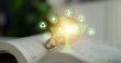 © InfiniteFlow - Light Bulb Growing into Tree Symbolizing Renewable Energy and Sustainability Concept with Infographic Design in Soft Focus Background Quark.
