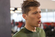 © New Africa - Tired man sweating after workout in gym