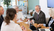 © JackF - Senior representatives of business community participate at round table talks, chatting, talking. Brain storm, team discussion, debate, business coffee break, professional meeting