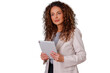 © Komora - Businesswoman standing, holding digital tablet, thinking, focused, contemplating corporate success and modern technology