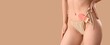 © Pixel-Shot - Young woman in stylish swimsuit and with ice cream on beige background with space for text