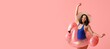 © Pixel-Shot - Happy young woman in stylish blue swimsuit and with inflatable ring in shape of flamingo on pink background with space for text