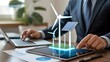 © Zunaira - Professional Businessman Analyzing Renewable Energy Data with Holographic Wind Turbines and Solar Panels on Tablet for Sustainable Development Strategy and Green Technology Investment Concept