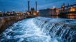 © Pinit - Sustainable infrastructure features flowing water and city lights at a treatment plant.