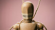 © Chopang.studio - Wooden mannequin with pressured label tied with rope, symbolizing stress and constraint on pink background