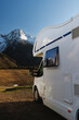 © 9parusnikov - White Camper Van Parked In Snowy Mountains