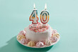 © Westend61 - Birthday cake with burning candles
