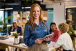 © Rido - Happy young businesswoman looking at camera