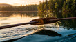 © Sekai - Polished rowing oar blade dipping into silky water creating golden droplets and elegant motion photography