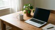 © justjupiter - A cozy wooden desk by a window features a laptop, a white coffee mug, a green potted plant, and a notebook with a pen, creating a calm workspace atmosphere.