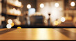 ©  Besticon25 - Empty wooden table top with blurred restaurant background and warm bokeh lights for product display montage in cafe setting