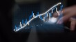 © InfiniteFlow - A digital representation of financial growth showcasing a dynamic chart with upward trends and a person using a laptop, illustrating modern business analytics. Copula