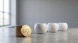 © Helen - Tax coins stacked beside white piggy banks on gray surface