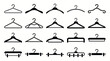 © Dharma - Various black silhouette clothing hanger icons on a clean white background, showcasing different designs for garments, representing fashion industry essentials and symbolizing retail store inventory