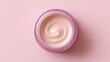 © Aisha - cosmetic cream jar showing smooth texture inside, top view minimal beauty concept, pastel color palette background and surface
