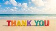 © Rina - 4k colorful beach scene with thank you message in sand