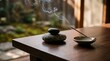 © Tharusha - Balanced zen stones with burning incense stick for meditation concept
