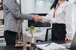 © Kritdanai - Lawyers shaking hands after agreement