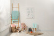 © New Africa - Different toys, small chairs, wooden ladder and picture in child's room, space for text