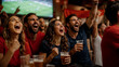 © Gustavo Alves - Friends celebrating soccer match in sports bar