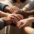 © simohamed - Diverse group of people stacking hands together in unity and teamwork