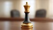© buraratn - Elegant golden and black chess king piece standing prominently on a polished wooden table in a blurred office meeting room background