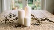 © TehGendul - Three white candles on a table.