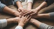 © KHIAR.PROJECTS - Diverse people stacking hands together as a sign of unity and teamwork