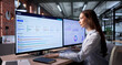 © Andrey Popov - Young Woman Reviews Project Progress Using KPI Dashboard