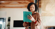 © peopleimages.com - Tablet, remote work and woman in apartment for email, ebook research or story development. Tech, freelance author and mature person by window in home for editing manuscript, planning and space