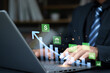 © Ei - Business profit and quality management concept. businessman using laptop with finance and quality icons, cost planning, budgeting, product quality and business performance analysis.