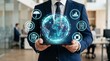 © Umer - Businessman holding tablet with digital globe and icons in office