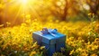 © Collection - A wrapped present sits nestled amongst a field of bright yellow wildflowers bathed in the golden light of the setting sun, a charming scene of springtime joy and anticipation.