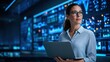© 5 Grace Media - Female Engineer in Data Center Looking at Server Racks with Laptop.