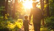 © Odagiri - 夕暮れの森の小道を手をつないで歩く父と子の後ろ姿