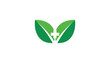 © Ganjani - Green Leaves with a White Cross Symbolize Natural Health and Wellness Logo Designs
