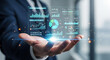 © JimDesign - Businessman holding a futuristic digital portfolio management dashboard interface