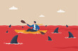© Hanufa - Red ocean market, high competition industry with too many competitors, intense market with challenge or difficult to success concept, businessman in kayak trying to survive in red ocean with sharks