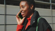 © Andrii Nekrasov - Smiling Woman On Phone In Urban Street