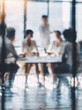 © Generative AI - Blurred image of a diverse business team in a modern office meeting room discussing strategy around a table with natural light