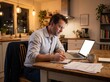 © Natalia Gotsyk - Man writing notes beside laptop mockup with blank white screen and documents at kitchen table in warm evening home workspace